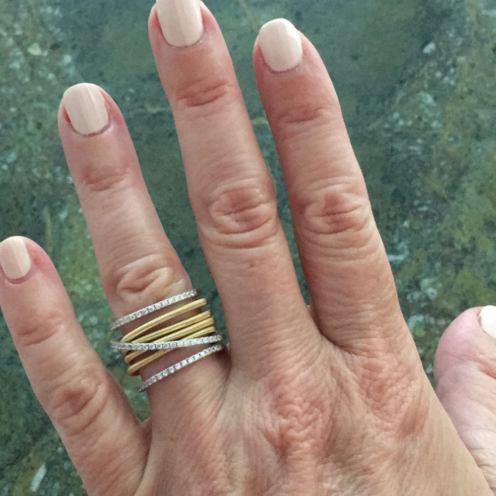Ring with crystal and gold accents.